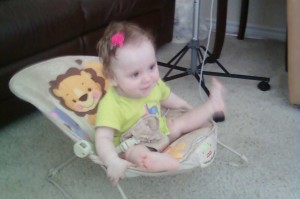 Julie enjoys TV while feeding