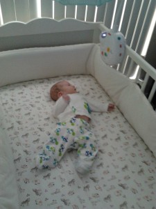Adam in his crib at two months