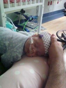 The doctor wants Julie to have more tummy time so she's balanced on the boppy