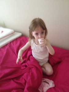 Julie drinking from an open cup