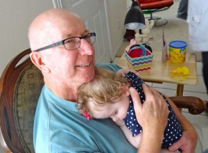"Grandpa" Dennis holding Julie at her birthday party